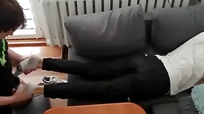 Young guy pays out his bills approximately his paws