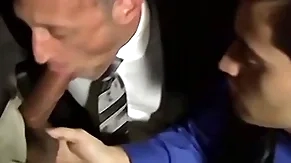 Undressed bearded stud sucking twosome cocks in an orgy