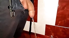 Laconic uncut cock pissing